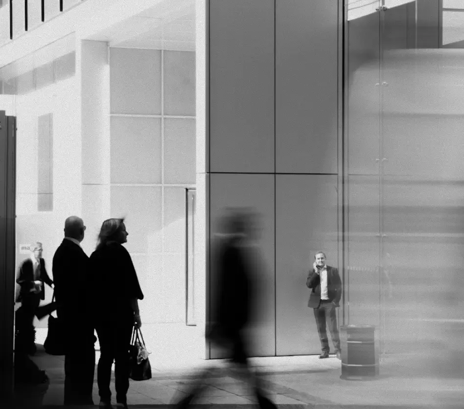 Journalists and delegates in the atrium of a financial institution